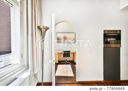 Arched doorway in modern apartment 77809868