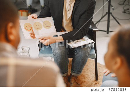 Family with daughter having a test at psyhoterapist Family with daughter having a test at psyhoterapist 77812053