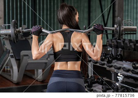 Beautiful Fitness Women Exercising At the Gym Beautiful Fitness Women Exercising At the Gym 77815736