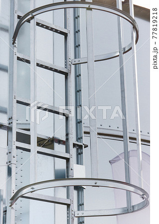 Ladder on silo for storage grain after harvest. Detail of agricultural equipments 77819218