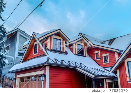 House featuring red wood exterior wall and attached garage with glass paned door House featuring red wood exterior wall and attached garage with glass paned door 77822570