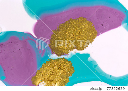 Gold glitter on liquid acrylic background. Marble blue and purple abstract pattern. Gold glitter on liquid acrylic background. Marble blue and purple abstract pattern. 77822629