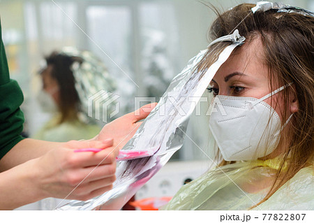 Hair coloring in the salon, hair bleaching. Hair coloring in the salon, hair bleaching. 77822807