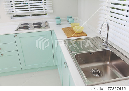 modern luxury sink with a tap in the home kitchen. modern luxury sink with a tap in the home kitchen. 77827656