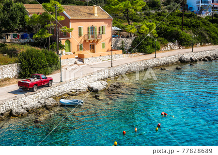 Crystal clear water in the port of Fiskardo Crystal clear water in the port of Fiskardo 77828689