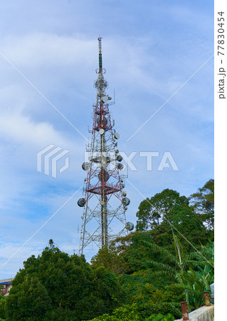Metal radio tower in the jungle a Metal radio tower in the jungle a 77830454
