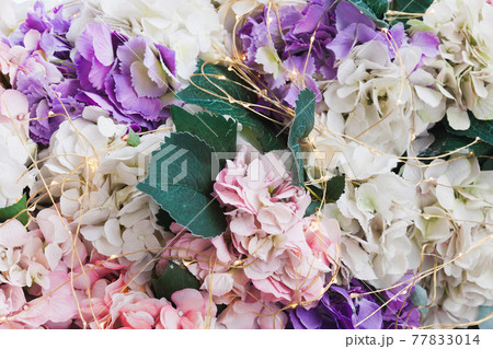 Artificial decorative flowers and an electric garland 77833014