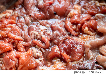 Various parts of raw sliced pork with marinated pork, pork belly, pork liver in stall 77836776