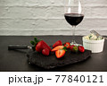 Ripe juicy red beautiful strawberry close-up is an appetizing fresh snack 77840121