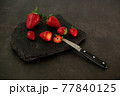 Ripe juicy red beautiful strawberry close-up is an appetizing fresh snack 77840125