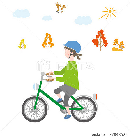 秋の屋外で自転車に乗る女の子のイラスト素材