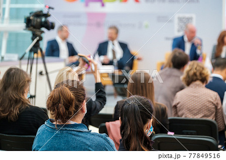 Speakers discussing business problems in auditorium Speakers discussing business problems in auditorium 77849516
