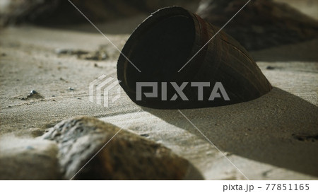 Old wooden barrel on the beach Old wooden barrel on the beach 77851165