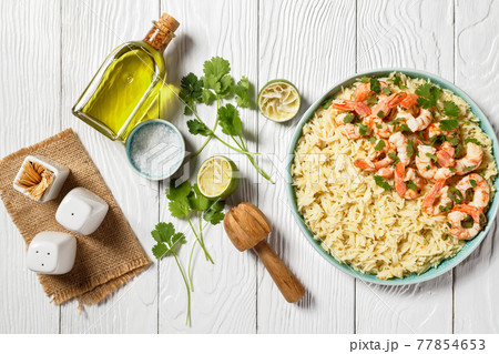Lime shrimps with cilantro and rice, top view Lime shrimps with cilantro and rice, top view 77854653