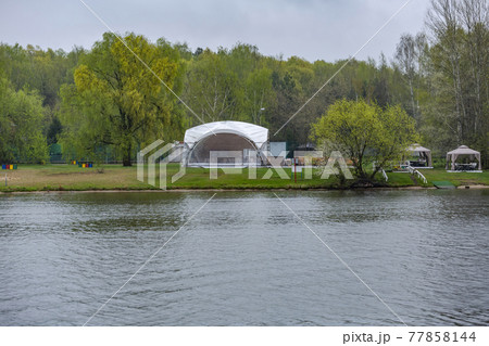 A gazebo made of white tarpaulin on the banks of the river for tourists A gazebo made of white tarpaulin on the banks of the river for tourists 77858144