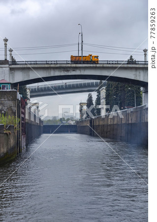 Old gateway on the Moskva River in cloudy rainy weather. Russia Old gateway on the Moskva River in cloudy rainy weather. Russia 77859263