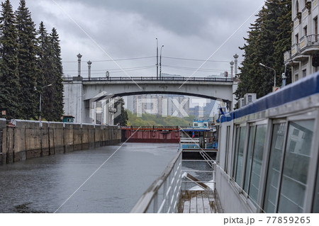 Old gateway on the Moskva River in cloudy rainy weather. Russia Old gateway on the Moskva River in cloudy rainy weather. Russia 77859265