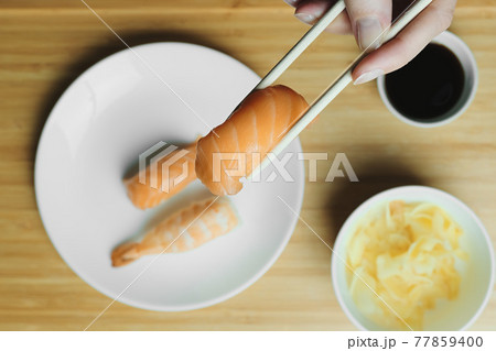 Japanese kitchen. Set of Japanese sushi and rolls. Food sticks. Japanese kitchen. Set of Japanese sushi and rolls. Food sticks. 77859400