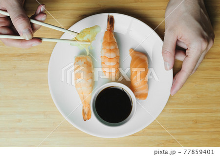 Japanese kitchen. Set of Japanese sushi and rolls. Food sticks. Japanese kitchen. Set of Japanese sushi and rolls. Food sticks. 77859401