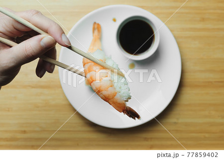Japanese kitchen. Set of Japanese sushi and rolls. Food sticks. Japanese kitchen. Set of Japanese sushi and rolls. Food sticks. 77859402