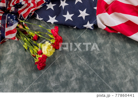 American flag for Memorial Day in Remembrance Veterans Day pink carnation flowers American flag for Memorial Day in Remembrance Veterans Day pink carnation flowers 77860441