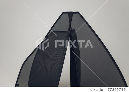Cover on the windshield of the car from freezing - Frozen car windscreen cold weather. 77865756
