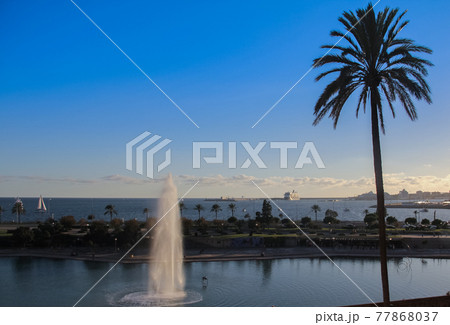 Beautiful image of seascape of Palma de Mallorca. Stunning seascape. Travel and vacation. Amazing marine view, water, sky, fountain, palm tree background. Beautiful image of seascape of Palma de Mallorca. Stunning seascape. Travel and vacation. Amazing marine view, water, sky, fountain, palm tree background. 77868037