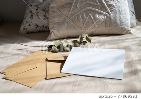 blank greeting card  invitation mockup with craft paper envelope  feminine still life composition 77869533