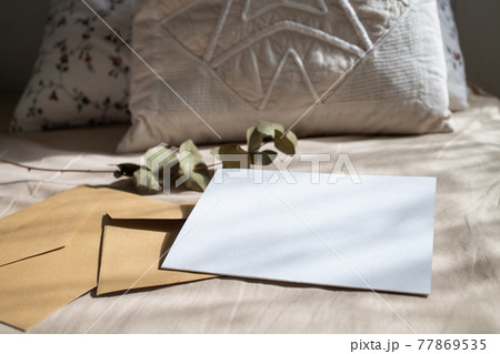 blank greeting card  invitation mockup with craft paper envelope  feminine still life composition 77869535