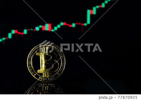 Bitcoin stock. Gold Crypto currency BTC Bitcoin on graph chart background. Golden Bit Coin virtual cryptocurrency or blockchain technology. Virtual money and mining concept. 77870935