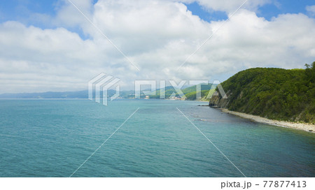 Drone view of rocks, nature, sea and water - Skala Kiseleva is a natural monument on the territory of the Tuapse district of the Krasnodar Territory. Aerial view from above. 4K footage. 77877413