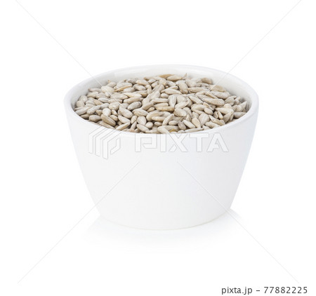 Sunflower seeds isolated on white background. Sunflower seeds isolated on white background. 77882225