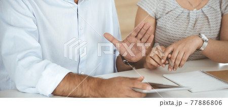 Unknown businessman and woman working with computer in a modern office, close-up. Group of diverse people. Teamwork, partnership and business concept Unknown businessman and woman working with computer in a modern office, close-up. Group of diverse people. Teamwork, partnership and business concept 77886806