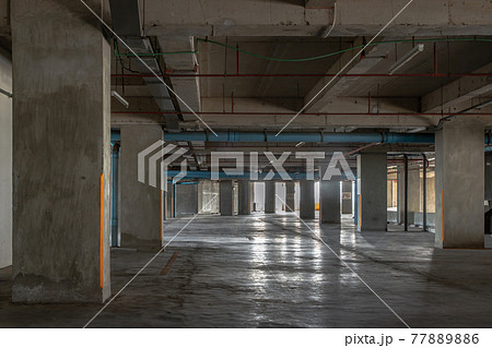 Vacant parking lot in car park building at condominium. Empty car parking garage in the afternoon. Vacant parking lot in car park building at condominium. Empty car parking garage in the afternoon. 77889886