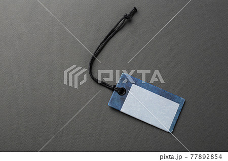 Blank tag tied with string. Blank tag tied with string. 77892854