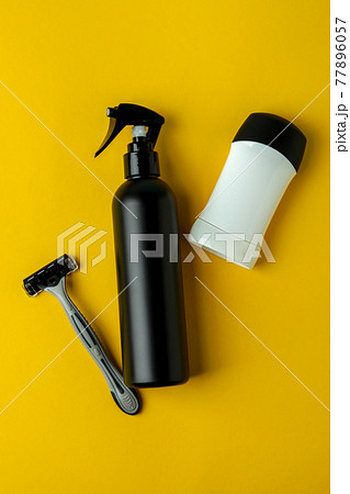 Concept of men's hygiene tools on yellow background 77896057