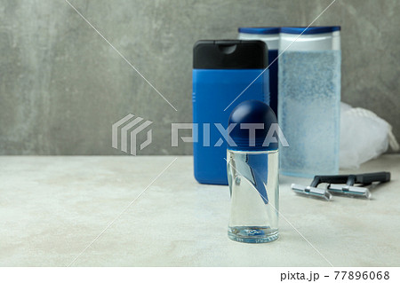 Concept of men's hygiene tools on white textured table Concept of men's hygiene tools on white textured table 77896068