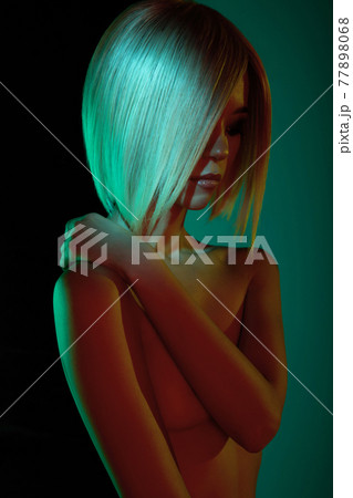 Nude sexy blonde in colorful light. Night club dance Nude sexy blonde in colorful light. Night club dance 77898068