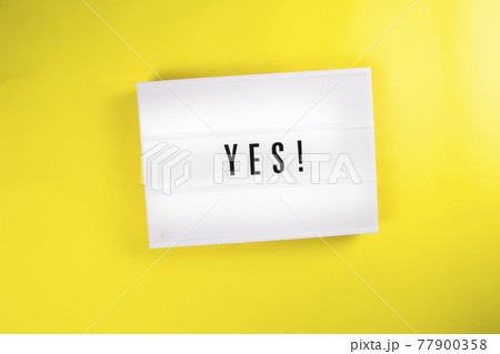 Lightbox with text YES isolated on yellow background, decision, voit, agreement 77900358