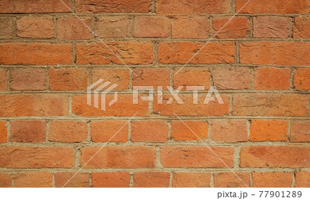 Simple hand made brick wall. Detailed photo of brickwork. 77901289