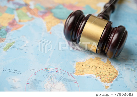Bangkok, Thailand - December 1, 2020 Australia ; Gavel for judge lawyer on wold globe map. Law and justice court concept. 77903082