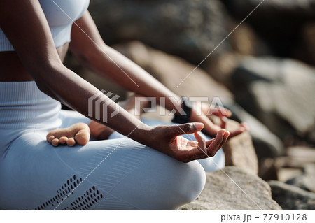 Woman practicing meditation 77910128