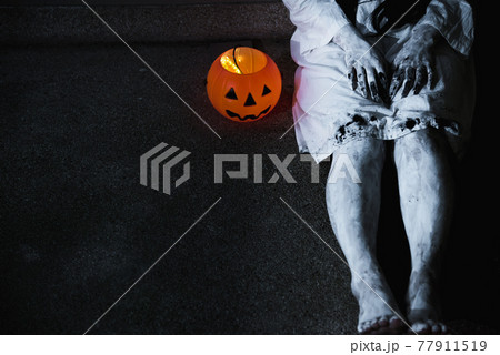 Woman ghost horror her have pumpkin beside body, Woman ghost horror her have pumpkin beside body, 77911519