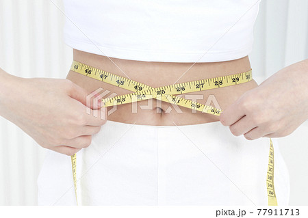 waist tape measure, body size and diet concept 77911713