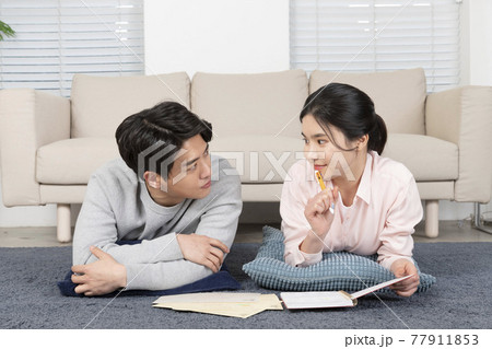 Asian newlyweds, couple managing home living expense 77911853
