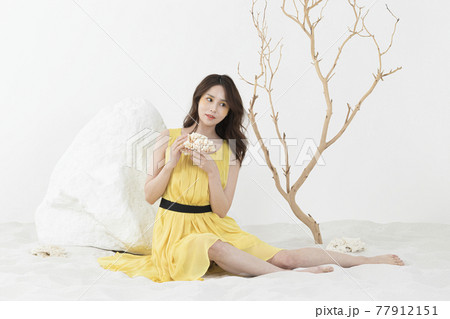 beautiful Asian model in yellow dress, spring beauty concept beautiful Asian model in yellow dress, spring beauty concept 77912151