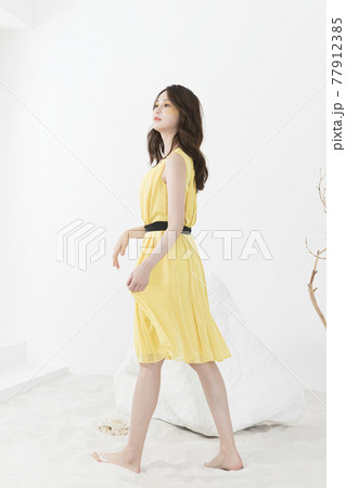beautiful Asian model in yellow dress, spring beauty concept beautiful Asian model in yellow dress, spring beauty concept 77912385