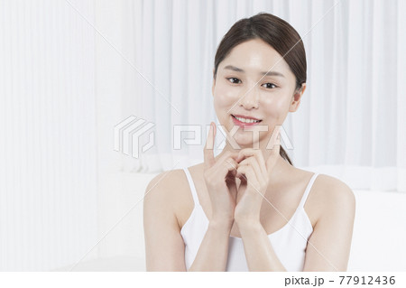 closeup of beautiful Asian model touching lips, beauty, surgery concept closeup of beautiful Asian model touching lips, beauty, surgery concept 77912436