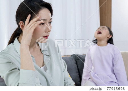 angry Asian young daughter shouting to mother 77913698