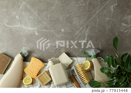 Cleaning concept with eco friendly cleaning tools on gray textured table 77915448